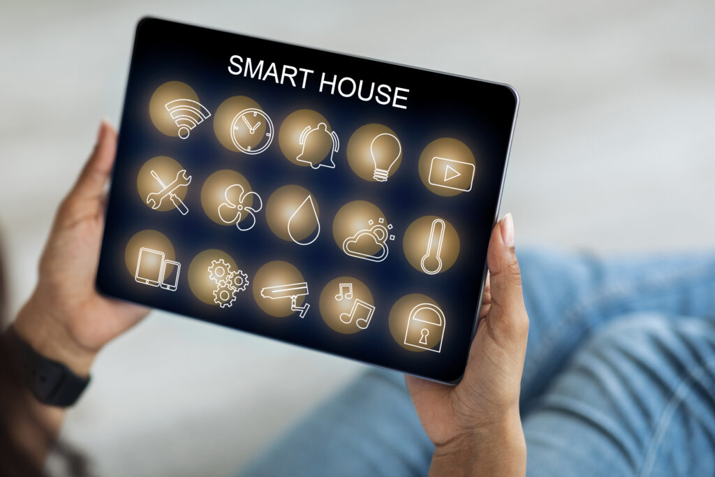 Smart house panel in unrecognizable black woman hands, closeup, creative image for modern technologies and household. African american lady using smart home application on digital tablet, cropped